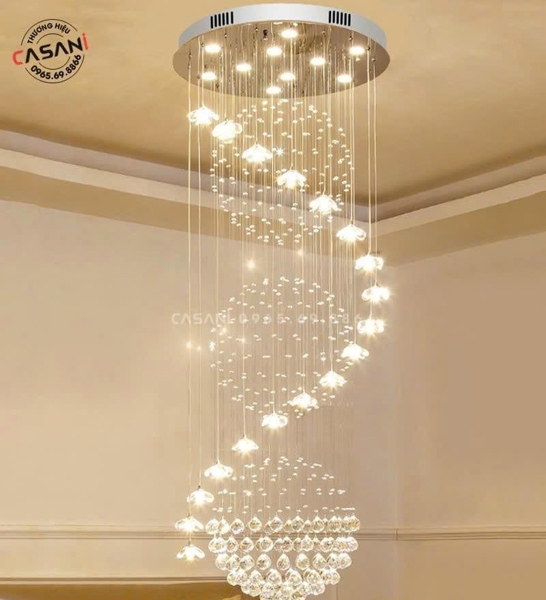 Đèn thông tầng 021PLD – Vũ Khúc Tinh Hoa Pha Lê gồm 157 dây pha lê, 22 đèn thả hoa pha lê G4, 17 đèn dimmer COB D40 3 màu có điều khiển xa 2.4G, mâm tròn inox gương trắng cao cấp, KT(mm): D1000 x H3000