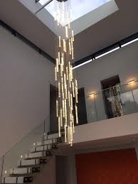 Bộ đèn thông tầng TH474 gồm mâm vuông inox gương vàng 8K bo tròn, 100 đèn thả tự do D30xH300mm và 10 dimmer D40 có điểu khiển xa, KT(mm): D1000 x H3000